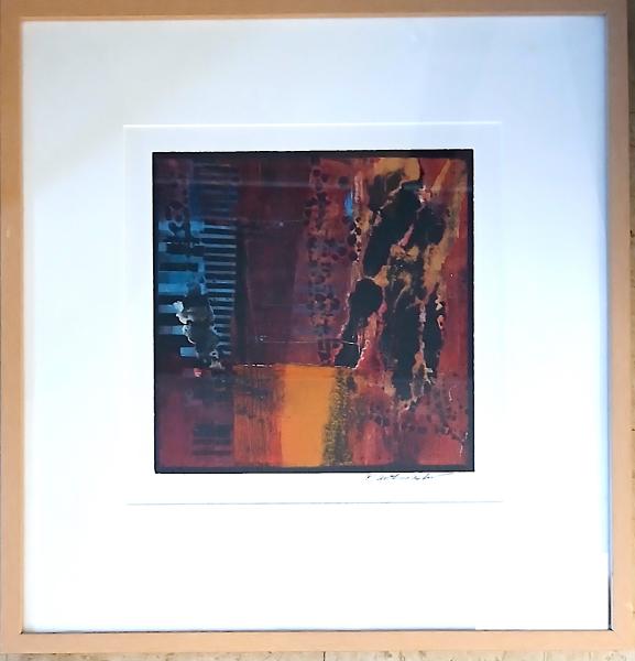 Blue Riff by Tony Askew Framed abstract artwork with a white mat, featuring a central composition of deep reds, burnt orange, black, and muted blue textures arranged in layered blocks and organic streaks