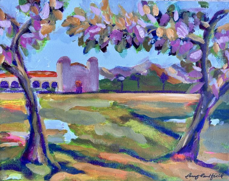 View of the Mission by Carey Caulfield Colorful impressionistic landscape painting of a mission building framed by trees with mountains in the background.